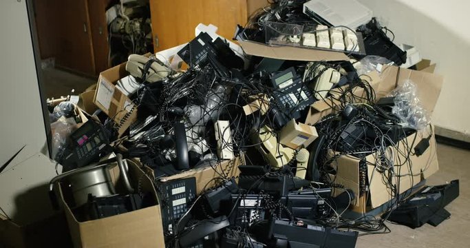 A heap of electrical waste in an office room