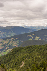 Naklejka premium Alpe di Siusi, Seiser Alm with Sassolungo Langkofel Dolomite, a view of a large mountain in the background