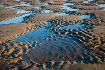 Pattern in the sand at low tide on the beach near Hunstanton, The Wash, Norfolk, England, UK