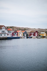 Fototapeta na wymiar Beautiful little town of smögen in sweden, boats, model and flags