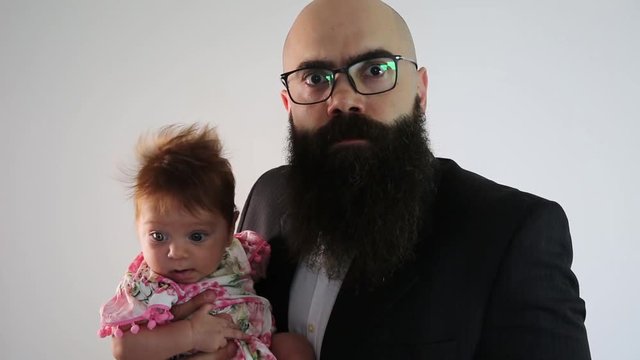 Furious man protecting his daughter so no boy comes close. Concept of father who does not want his daughter to date or overprotective parents.