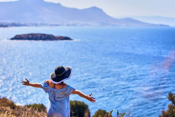 Beautiful woman in beach hat enjoying sea view with blue sky at sunny day in Bodrum, Turkey. Vacation Outdoors Seascape Summer Travel Concept