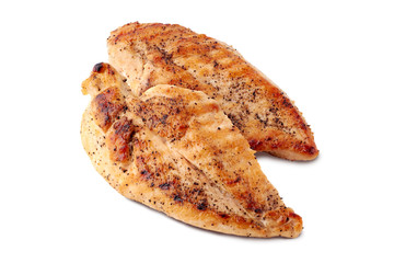Two roasted chickel fillets on white background