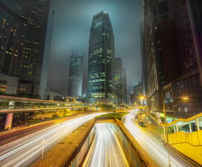 Fototapeta na wymiar Traffic on streets of Hong Kong at night, China