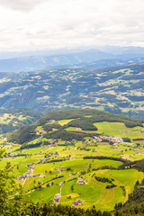 Alpe di Siusi, Seiser Alm with Sassolungo Langkofel Dolomite, a view of a lush green hillside