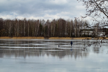 Fishing on melting ice lake