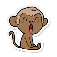 sticker of a cartoon laughing monkey
