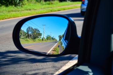 highway in the rearview mirror