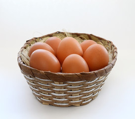 eggs in a basket on a white background