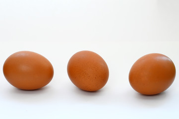 three eggs on white background