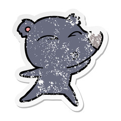 distressed sticker of a cartoon whistling bear