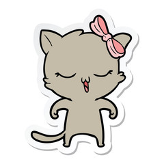 sticker of a cartoon cat with bow on head