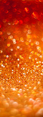 Blurred golden background, bokeh og glitters on fabric, Festive warm backdrop with copy space.