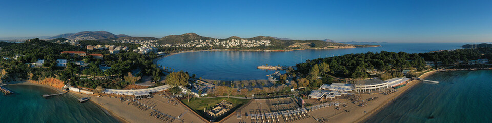 Fototapeta premium Aerial drone photo of iconic turquoise sandy celebrity beach of Asteras or Astir and ancient temple of Apollo Zoster, Vouliagmeni, Athens riviera, Attica, Greece
