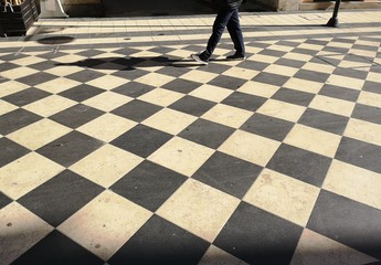 man on checkered floor