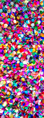 Lot of small round colorful confetti made of paper. Festive bright background