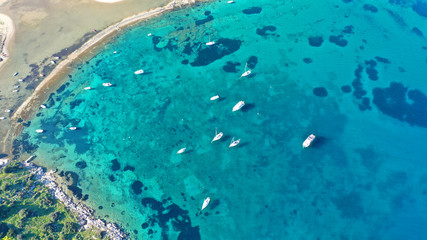 Aerial drone bird's eye photo of traditional fishing boat in island of Mykonos, Cyclades, Greece