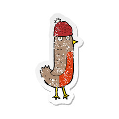 retro distressed sticker of a cartoon christmas robin wearing hat