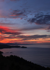 Fototapeta na wymiar Sunset on the coast of Gipuzkoa with Getaria in the background, Basque Country