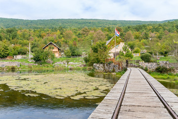 old wooden mill and closeup of bridge at gacka river in central croatia