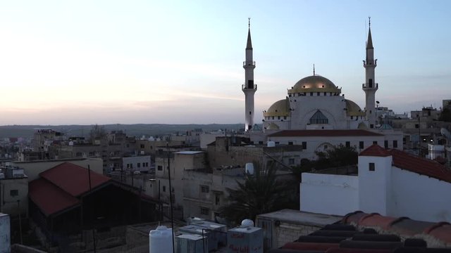 A Timelapse of Sunrise in Madaba City with the Mosque of Jesus Christ in the Background