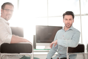 Fototapeta premium Manager and employee sitting near the desktop
