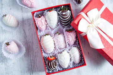 chocolate strawberries on box on desk