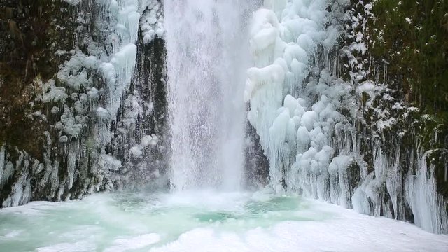Icy Blue Frozen Waterfall in Oregon USA