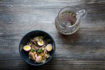 top view noodles with shiitake mushrooms, eggs, wheat sprout