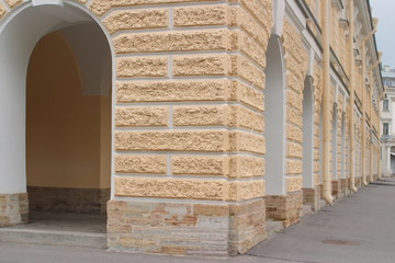 Image of a fragment of an old merchant's place with columns and a gallery