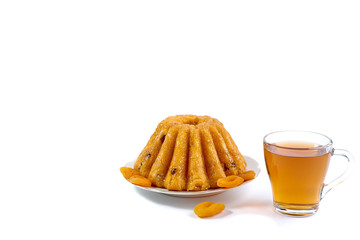 Rum Baba with a cup of tea on a white background with space for inscription