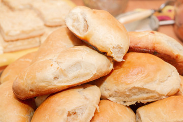 Ruddy delicious freshly baked cakes laid out in a pile on the plate