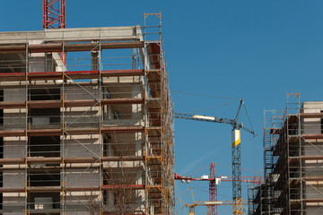 Construction site of an apartment building with crane