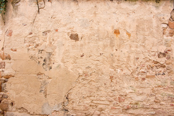 Hintergrund – alte verputzte  Natursteinmauer