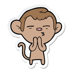 sticker of a cartoon suspicious monkey