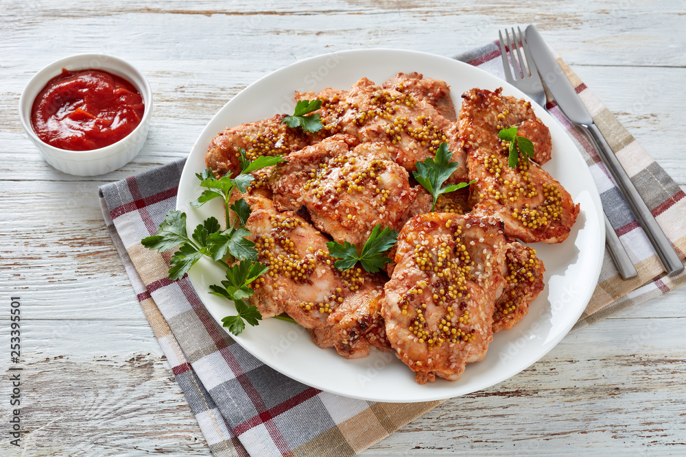 Poster chicken staeks on a plate, top view