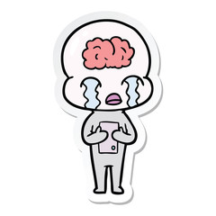 sticker of a cartoon big brain alien crying