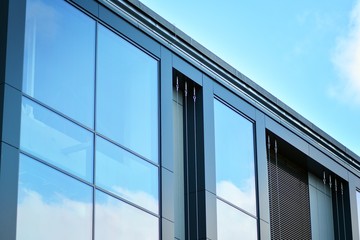 Fototapeta na wymiar Sky reflected in a modern building glass facade