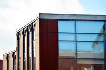 Sky reflected in a modern building glass facade