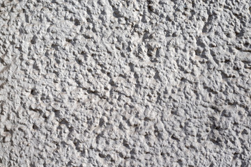Graue Betontruktur mit harten Kontrasten