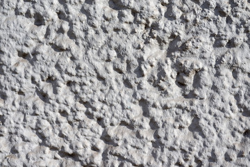 Graue Betontruktur mit harten Kontrasten