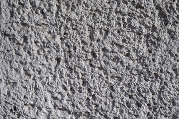 Graue Betontruktur mit harten Kontrasten