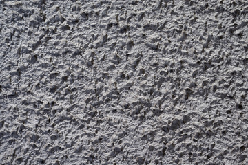 Graue Betontruktur mit harten Kontrasten