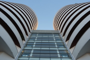 modern rounded buildings seen from below
