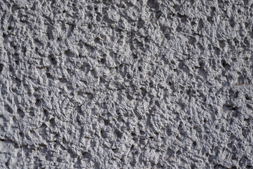 Graue Betontruktur mit harten Kontrasten