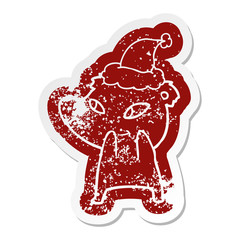 cute cartoon distressed sticker of a bear wearing santa hat