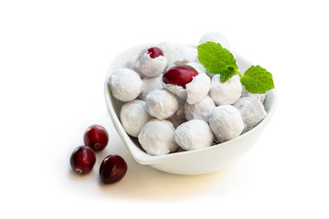 Frosted sugar coated cranberry in white saucer