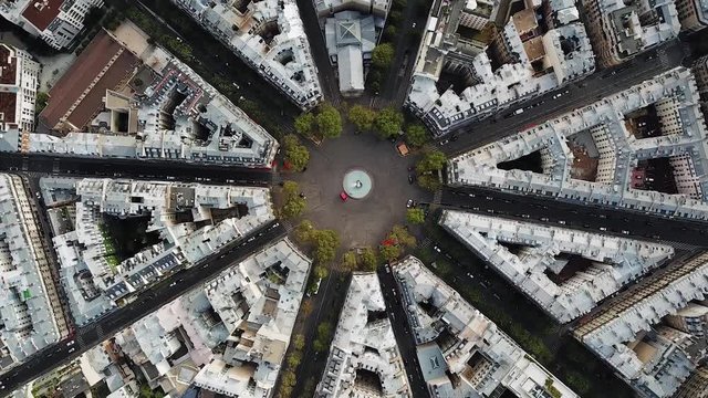 Aerial, screwdriver, drone shot, of streets, in the cityscape of Paris, on a sunny, summer day, in France