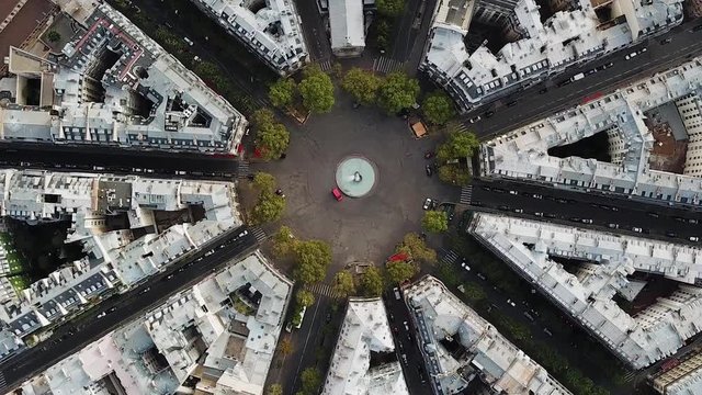 Aerial, cropped, screwdriver, drone shot, of streets, in the cityscape of Paris, on a sunny, summer day, in France