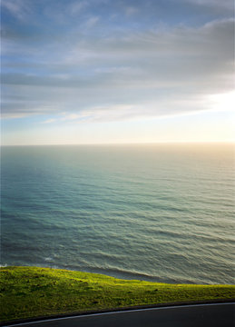 Grassy hills and the ocean beyond